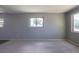 Bright and airy living room with neutral walls and carpet flooring at 1099 Wheeling St, Aurora, CO 80011