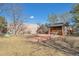 Spacious backyard with a large metal garage and shaded gazebo at 2372 Haskell Way, Watkins, CO 80137