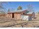 Barn exterior with pink wood and white trim with stalls at 2372 Haskell Way, Watkins, CO 80137