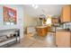 Warm kitchen featuring hardwood floors, stainless steel appliances, and pot rack over the island at 2372 Haskell Way, Watkins, CO 80137