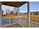 Outdoor balcony with a wood floor and white railing overlooking a fenced yard and neighborhood at 288 Dover Ct, Broomfield, CO 80020