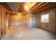 Unfinished basement with concrete floor, exposed ceiling and a small window at 288 Dover Ct, Broomfield, CO 80020