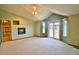 Spacious bedroom featuring neutral carpet, a fireplace, and access to a private balcony at 288 Dover Ct, Broomfield, CO 80020