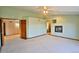 Spacious bedroom featuring neutral carpet, a fireplace, and multiple entry points at 288 Dover Ct, Broomfield, CO 80020