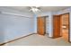 Light blue bedroom featuring an open closet and doorway, creating an inviting space at 288 Dover Ct, Broomfield, CO 80020