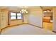 Bright dining room features a chandelier, built in shelving, and a large window at 288 Dover Ct, Broomfield, CO 80020