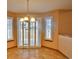 Bright dining area with tiled floors, shuttered windows, and sliding glass doors at 288 Dover Ct, Broomfield, CO 80020