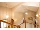 Open entryway featuring high ceilings, hardwood banisters and gorgeous light fixtures at 288 Dover Ct, Broomfield, CO 80020