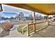 View from covered front porch with white railings looking out to neighborhood street at 288 Dover Ct, Broomfield, CO 80020