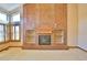 Close up view of the fireplace, built in shelving, and a window in this bright living room at 288 Dover Ct, Broomfield, CO 80020