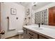 Tastefully renovated bathroom featuring a modern vanity, stylish fixtures, and a shower with a decorative curtain at 3355 Hickok Pl, Boulder, CO 80301