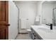 Bathroom featuring updated vanity, gray cabinets and a white shower curtain at 3355 Hickok Pl, Boulder, CO 80301