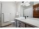 Bathroom features a white sink, gray cabinets and a shower with a gray shower curtain at 3355 Hickok Pl, Boulder, CO 80301