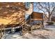 Back of unit showing outdoor deck with railing, seating and stairs leading to lower area at 3355 Hickok Pl, Boulder, CO 80301