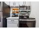 This kitchen features stainless steel appliances, gray cabinets and gray backsplash at 3355 Hickok Pl, Boulder, CO 80301