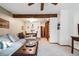 Open-concept living room flowing into the dining area, with a wooden ceiling beam overhead at 3355 Hickok Pl, Boulder, CO 80301