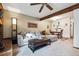 Open-concept living room flowing into the dining area, with a wooden ceiling beam overhead at 3355 Hickok Pl, Boulder, CO 80301