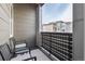 Private balcony with seating for relaxing and enjoying the view at 460 E Fremont Pl # 301, Littleton, CO 80122