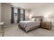 Comfortable bedroom with a queen-size bed and neutral color scheme at 460 E Fremont Pl # 301, Littleton, CO 80122