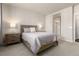 Bright bedroom featuring a double bed, nightstands, and a view of the bathroom at 460 E Fremont Pl # 301, Littleton, CO 80122