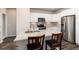 Modern kitchen with white cabinets and granite countertops at 460 E Fremont Pl # 301, Littleton, CO 80122