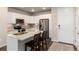 Modern kitchen with stainless steel appliances and island at 460 E Fremont Pl # 301, Littleton, CO 80122