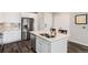 Modern kitchen with granite countertops and island at 460 E Fremont Pl # 301, Littleton, CO 80122