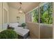 Cozy balcony featuring comfortable seating, decorative lighting, and a view of lush greenery at 344 Saint Paul St, Denver, CO 80206