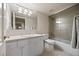 Functional bathroom with a tub and shower combo, toilet, and spacious vanity with a sink at 344 Saint Paul St, Denver, CO 80206
