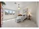 A sun-filled bedroom boasts carpeted floors, a picture window, and neutral color scheme at 344 Saint Paul St, Denver, CO 80206