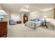 Carpeted bedroom with blue and white accents, a cozy chair, and a window for natural light at 344 Saint Paul St, Denver, CO 80206