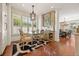 Bright breakfast nook with hardwood floors, designer rug, and a stylish light fixture at 344 Saint Paul St, Denver, CO 80206