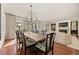 Dining area featuring a large table, elegant chairs, and a view of the living room at 344 Saint Paul St, Denver, CO 80206