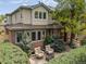 Charming home featuring a well-manicured lawn, lovely patio, and appealing architectural details at 344 Saint Paul St, Denver, CO 80206