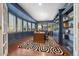Beautiful home office with custom built-in bookshelves, curved walls and lots of natural light at 344 Saint Paul St, Denver, CO 80206