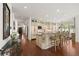 Spacious kitchen with custom cabinets, granite counters, and an island with seating at 344 Saint Paul St, Denver, CO 80206