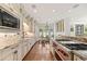 Gourmet kitchen with modern appliances, ample counter space, and recessed lighting at 344 Saint Paul St, Denver, CO 80206