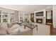 Living room with a fireplace, a glass coffee table, and patio access at 344 Saint Paul St, Denver, CO 80206