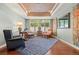 Comfortable living room featuring hardwood floors, decorative ceiling trim and eclectic furnishings at 344 Saint Paul St, Denver, CO 80206