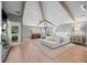 Spacious main bedroom with vaulted ceilings, wood beams, and a calming gray color palette at 344 Saint Paul St, Denver, CO 80206