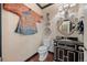 Unique powder room with artistic touches, decorative plates, and an ornate mirror at 344 Saint Paul St, Denver, CO 80206