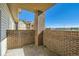 Balcony with brick siding and partial view at 875 E 78Th Ave # 9-2, Denver, CO 80229