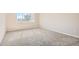 Bright bedroom with carpet, window, and natural light at 875 E 78Th Ave # 9-2, Denver, CO 80229