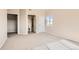 Spacious bedroom with carpet, adjacent bathroom, and natural light at 875 E 78Th Ave # 9-2, Denver, CO 80229