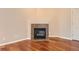 Fireplace with decorative tile surround and hardwood flooring at 875 E 78Th Ave # 9-2, Denver, CO 80229