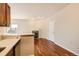 View of the living room featuring fireplace, window, and hardwood floors at 875 E 78Th Ave # 9-2, Denver, CO 80229