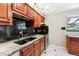 Renovated kitchen featuring granite counters, updated fixtures, and stainless steel appliances at 13258 E Alaska Pl, Aurora, CO 80012