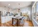 Bright dining area flows to the kitchen and features modern appliances and ample counter space at 111 S Monroe St # B203, Denver, CO 80209