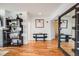 Stylish entryway with hardwood floors, modern decor, and a decorative mirror at 111 S Monroe St # B203, Denver, CO 80209