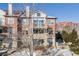 Brick condo building featuring multiple balconies, large windows, and a well-kept exterior at 111 S Monroe St # B203, Denver, CO 80209